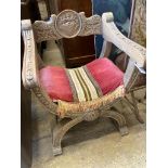 An 18th century style carved X frame oak chair, width 59cm, depth 49cm, height 77cm