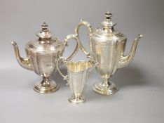 A Victorian engraved silver three-piece tea and coffee service, Frederick Elkington, Birmingham,