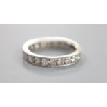 A white metal and diamond set full eternity ring,size N, gross 4.2 grams, set with twenty three