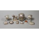 a cylindrical silver on copper container and cover and two Sterling silver miniature temple