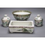 A Chinese circular famille rose bowl, a rectangular landscape-decorated planter and a pair of small