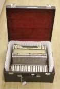 A cased Antoria Ludwig accordian, cased