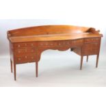 A Regency boxwood strung mahogany bowfront sideboard,with three quarter gallery, fitted five