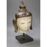 An 18th century Burmese white marble Shan-Style Buddha’s head, on stand, bought in 1995 in Burma or