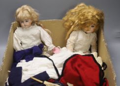 An Armand Marseille doll, an Ernst Heubach doll and a quantity of dolls' clothing, etc.