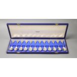 A set of twelve silver Signs of the Zodiac spoons by John Pinches, cased