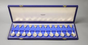 A set of twelve silver Signs of the Zodiac spoons by John Pinches, cased