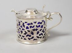 A Victorian silver cylindrical mustard pot with fretwork sides, Sheffield 1899, 74mm and a later