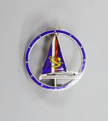 A white metal (stamped silver) and polychrome enamel yachting brooch, 20mm.