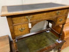 An early 20th century oak kneehole writing table, width 106cm, depth 55cm, height 77cm
