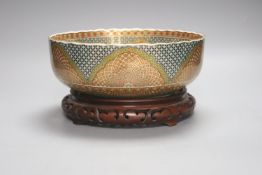 A Japanese porcelain bowl, on hardwood stand, diameter 25cm