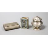 A filigree white metal cigarette box, an enamelled matchbox holder and a white metal mustard pot.