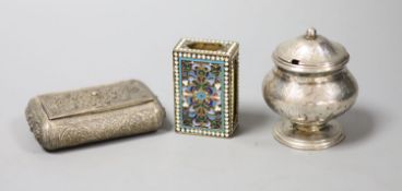 A filigree white metal cigarette box, an enamelled matchbox holder and a white metal mustard pot.