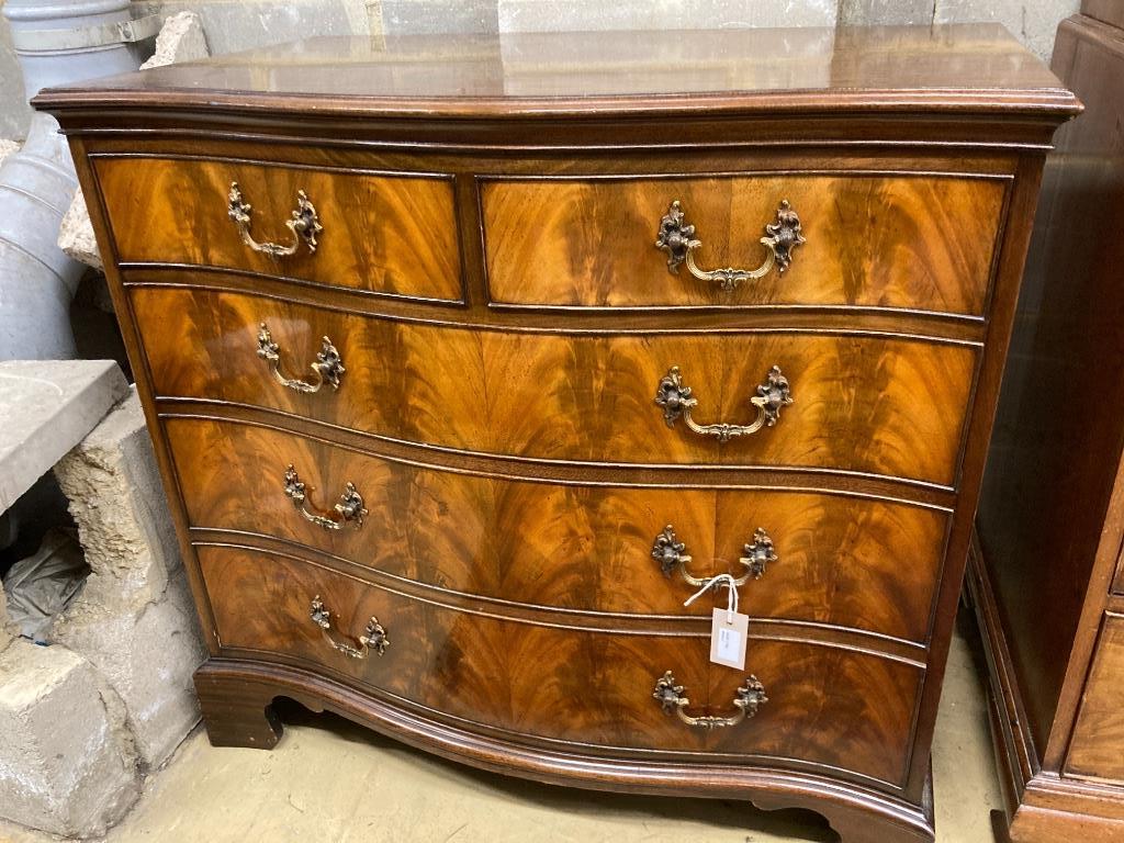 A George III style mahogany serpentine chestfitted two short drawers and three graduated long