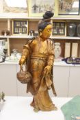 A large Chinese giltwood figure of a lady, height 59cm