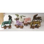 Eight Chinese 20th century carved hardstone 'Horses of Mu Wang'on hardwood stands