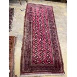 A Tekke Bokhara red ground rug, 254 x 109cm, together with a machined rug