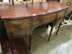 A late 19th century Sheraton style mahogany bowfront sideboard, fitted three drawers, length 140cm,