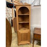 A pine standing corner cabinet, height 180cm