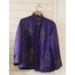 A Chinese purple brocade silk quilted jacket, length 71cm