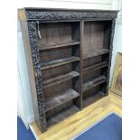 A 19th century Flemish carved oak open bookcase (adapted), length 150cm, depth 28cm, height 152cm