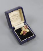 A 1970's 18ct gold, ruby and diamond quadruple cluster dress ring, by Ben Rosenfeld,size O, gross