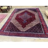 A Feraghan pattern red ground carpet, 320 x 250cm