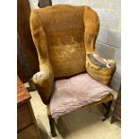 A George III provincial wing armchair, width 83cm, depth 60cm, height 124cm