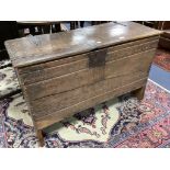 An early English oak six plank coffer, with shallow incised roundels and arched borders, 17th