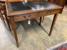A 1920's oak writing table, width 91cm, depth 60cm, height 76cm