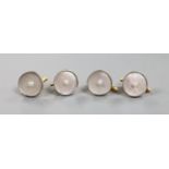 A set of four yellow metal (engraved 14), mother of pearl and seed pearl set dress studs,gross 10