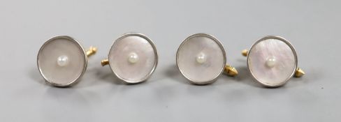 A set of four yellow metal (engraved 14), mother of pearl and seed pearl set dress studs,gross 10