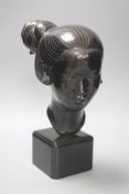 A Sino-Japanese 20th century bronze bust of a Geisha,on square plinth, with impressed mark, height