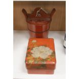 A Chinese red-lacquered rice container and cover and a similar Japanese rectangular box and cover (