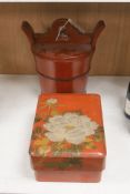 A Chinese red-lacquered rice container and cover and a similar Japanese rectangular box and cover (