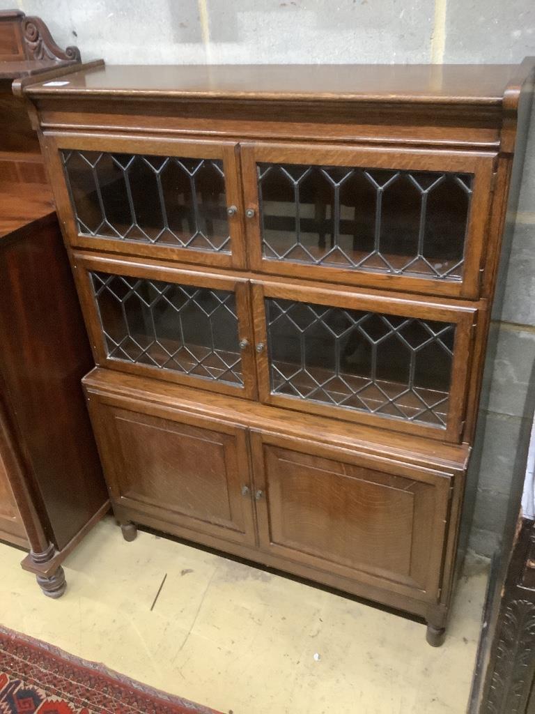 A 1920's leaded oak sectional bookcase, width 90cm