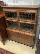 A 1920's leaded oak sectional bookcase, width 90cm