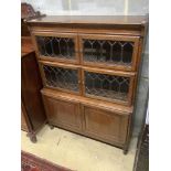 A 1920's leaded oak sectional bookcase, width 90cm