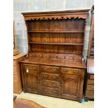 A reproduction 18th century style oak dresser, width 152cm, depth 54cm, height 198cm