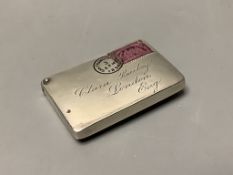 A late 19th century American? sterling and enamel novelty stamp case, modelled as an envelope,