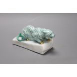 A Herend green ’fishnet’ model of a leopard crouching on a rock, signed Markup B