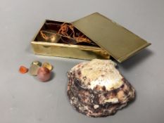 A set of scales for weight pearls and a shell