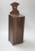 A 19th century oak candle box, height 45cm