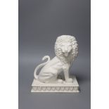 An Italian tin glazed pottery seated lion, height 25.5cm
