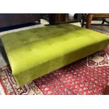 A contemporary Omega Italian velvet footstool, length 124cm, depth 88cm, height 24cm