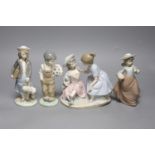 A Lladro figure, height 20cm, and three Nao figures