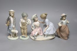 A Lladro figure, height 20cm, and three Nao figures