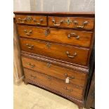 An early 19th century two part fruitwood chestfitted two short drawers and four graduated long