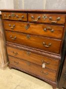 An early 19th century two part fruitwood chestfitted two short drawers and four graduated long