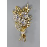 A modern two colour 14ct gold, sapphire, diamond and seed pearl set floral spray brooch, by Cropp &